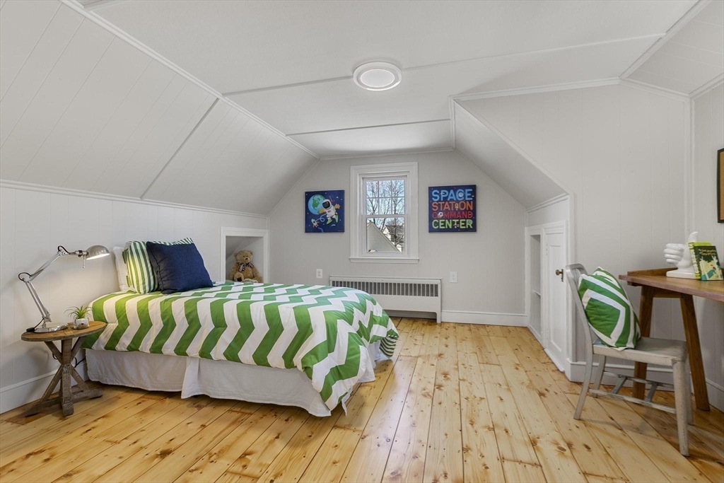 8 Crosby Road Reading, MA 01867 - Photo 19 of 30 a bedroom with a bed and wooden floor