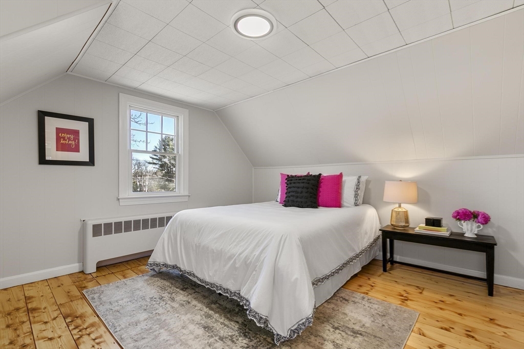 8 Crosby Road Reading, MA 01867 - Photo 20 of 30 a bedroom with a bed and a window