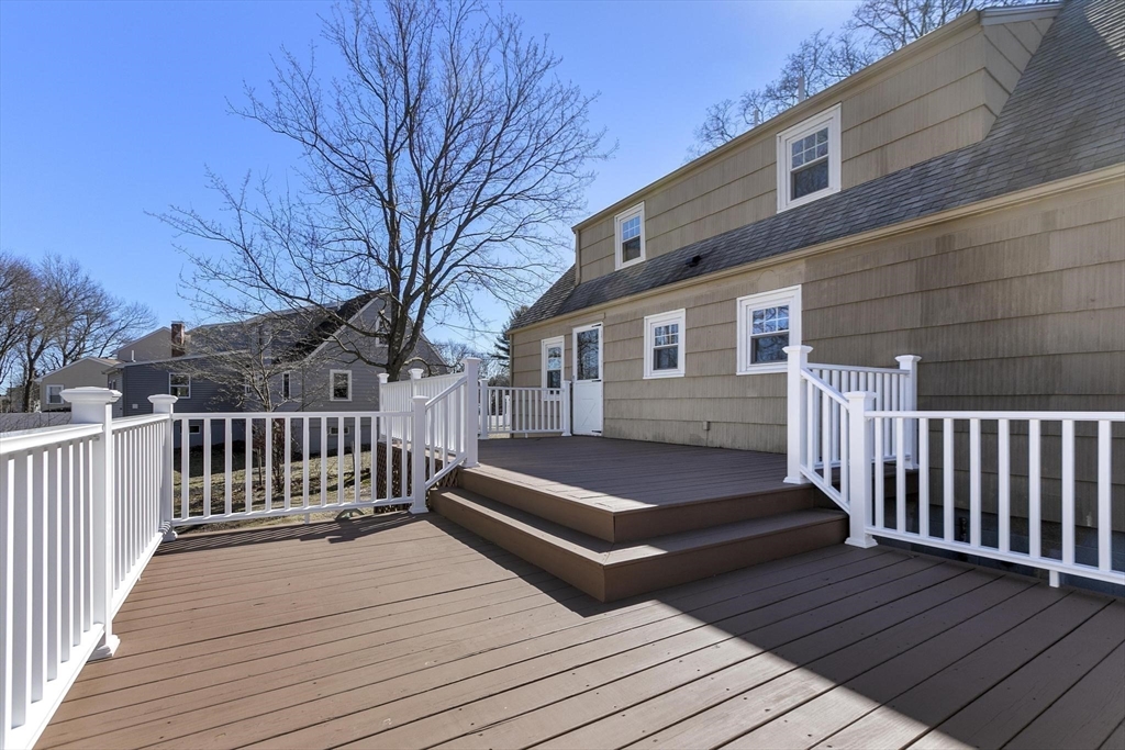 8 Crosby Road Reading, MA 01867 - Photo 26 of 30 a view of outdoor space with deck and kitchen view