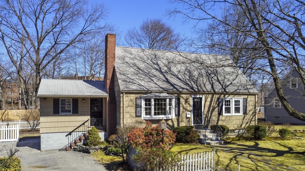 8 Crosby Road Reading, MA 01867 - Photo 29 of 30 a front view of a house with a yard
