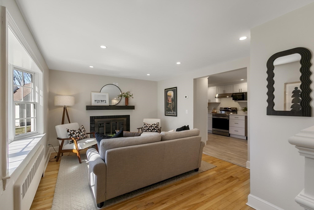 8 Crosby Road Reading, MA 01867 - Photo 5 of 30 a living room with furniture and a fireplace