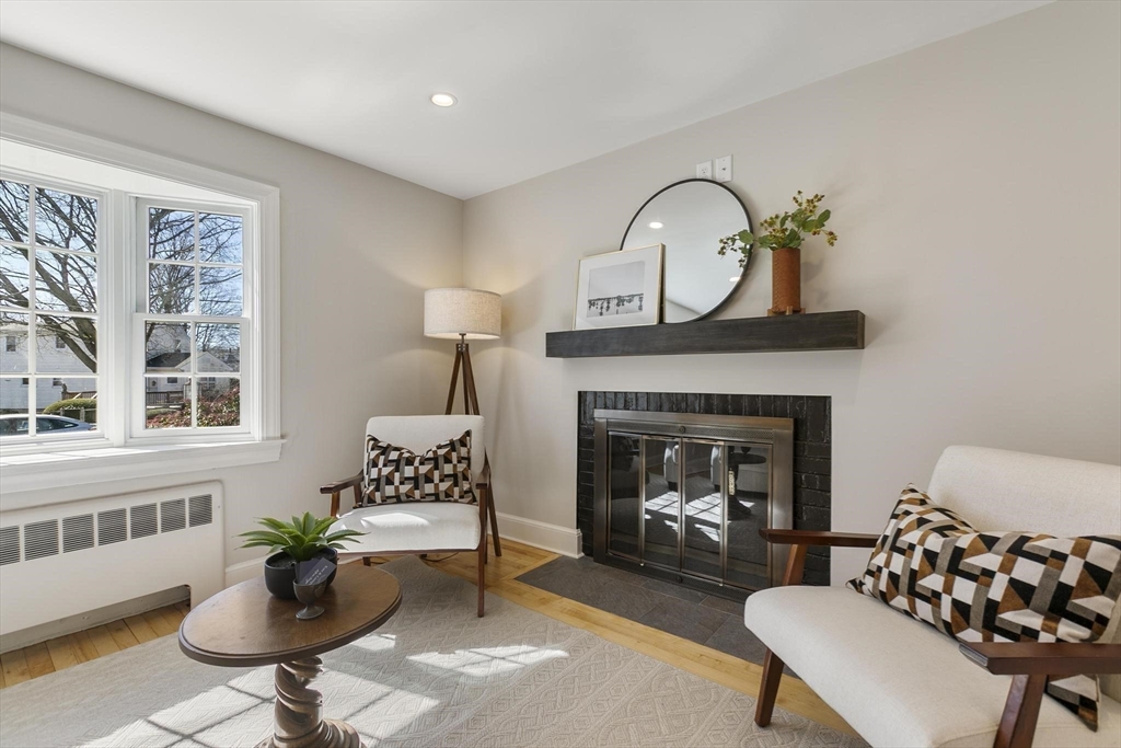 8 Crosby Road Reading, MA 01867 - Photo 8 of 30 a living room with furniture and a fireplace