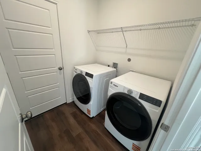 a utility room with dryer and washer