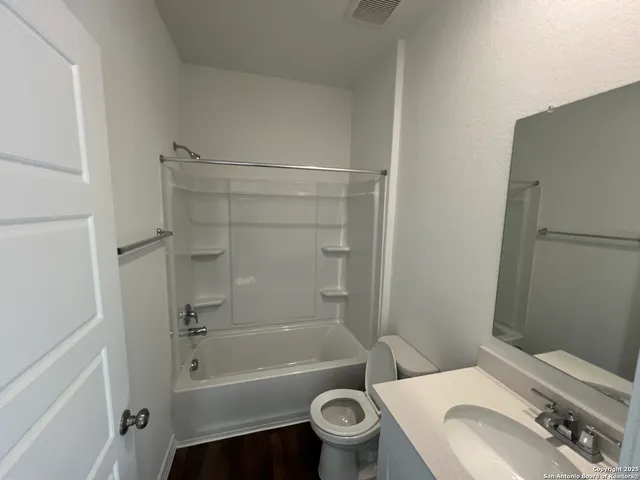 a bathroom with a sink toilet and bathtub
