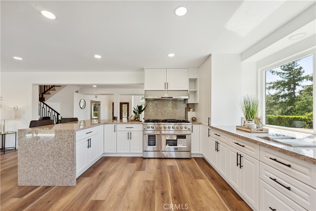 529 Manzanita Road Redlands, CA 92373 - Photo 15 of 64 a kitchen with stainless steel appliances granite countertop a stove and cabinets