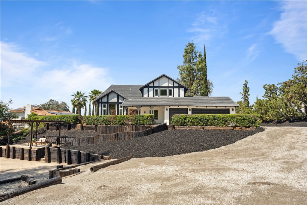 529 Manzanita Road Redlands, CA 92373 - Photo 2 of 64 a front view of a house with a yard and garage