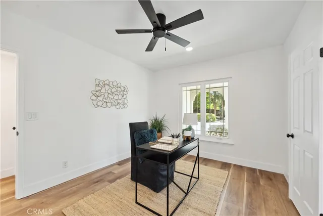 a living room with furniture a window and a fireplace