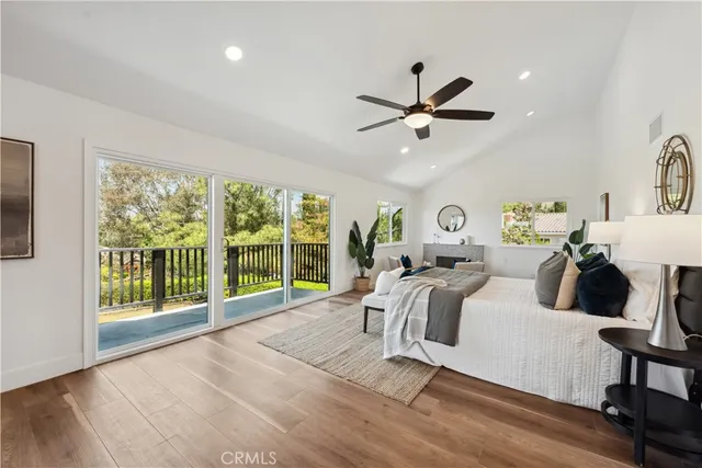 a view of a balcony with wooden floor and fence