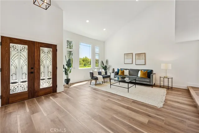 a living room with furniture and large window