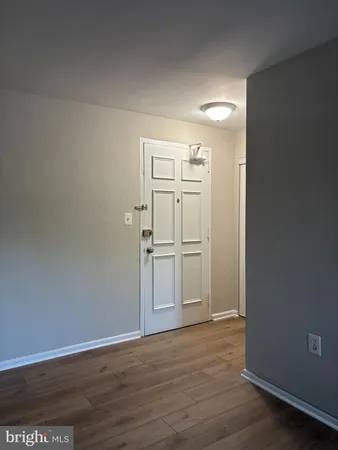 a view of a kitchen with wooden floor