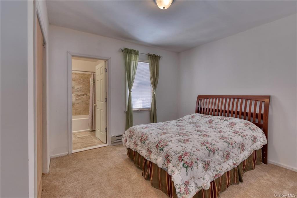 10 Maple Avenue, Unit 1 Fallsburg, NY 12789 - Photo 13 of 25 Primary bedroom with full bathroom.