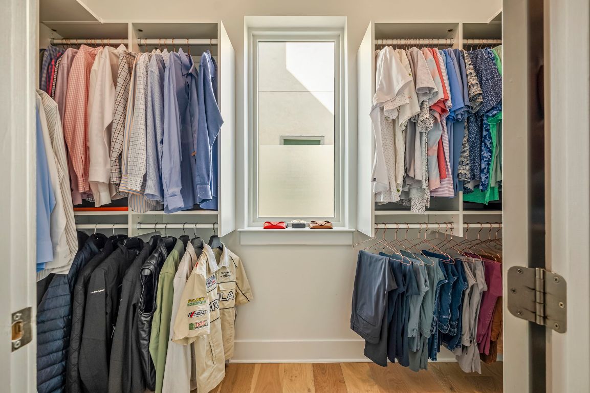 2300 Enfield Road, Unit 302 Austin, TX 78703 - Photo 15 of 26 a view of walk in closet with clothes