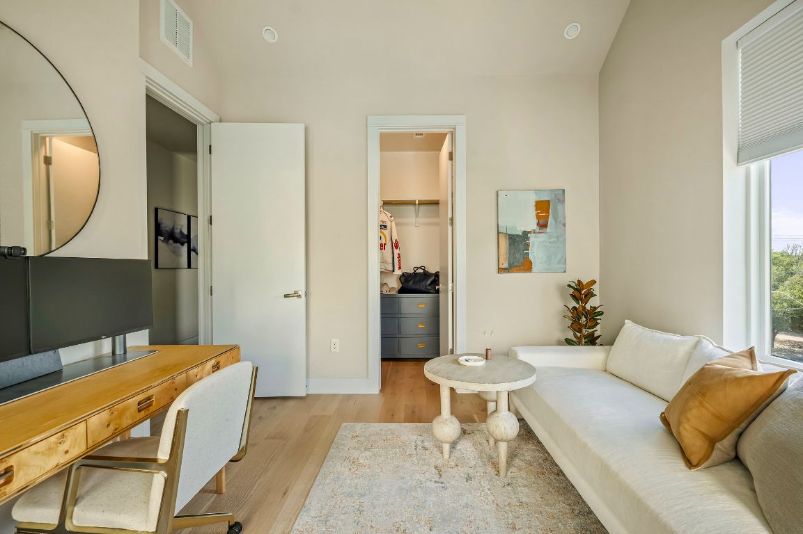 2300 Enfield Road, Unit 302 Austin, TX 78703 - Photo 18 of 26 a living room with furniture and a mirror