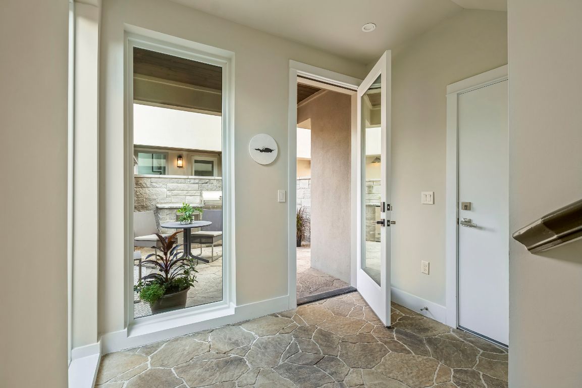 2300 Enfield Road, Unit 302 Austin, TX 78703 - Photo 20 of 26 a view of a bathroom with a glass door and glass door