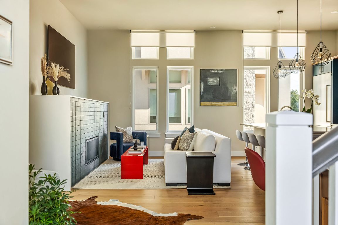 2300 Enfield Road, Unit 302 Austin, TX 78703 - Photo 2 of 26 a bedroom with furniture and a fireplace