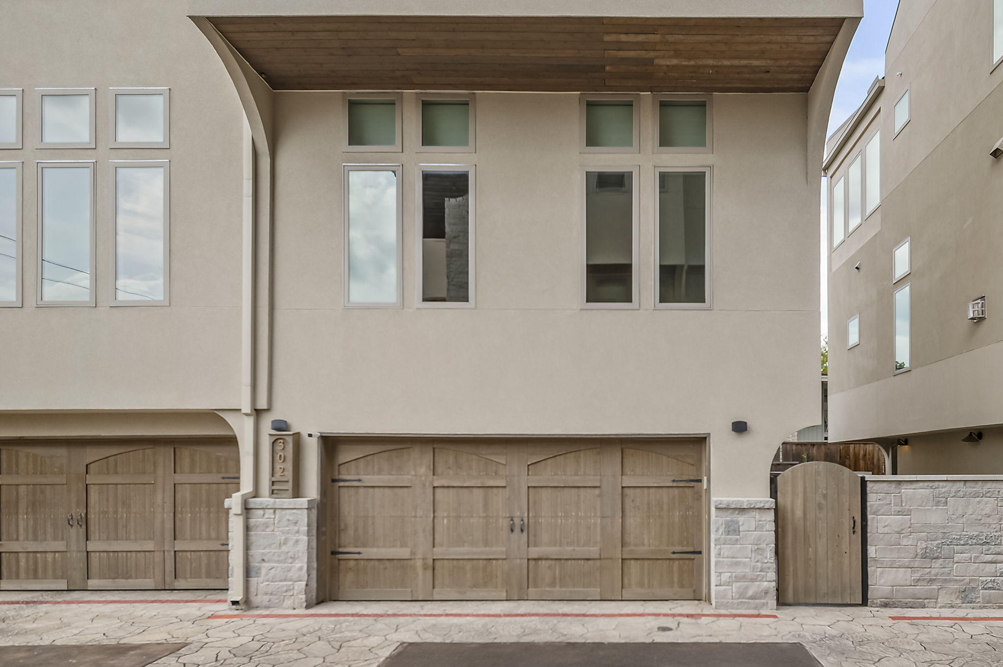 2300 Enfield Road, Unit 302 Austin, TX 78703 - Photo 23 of 26 a front view of a house with parking