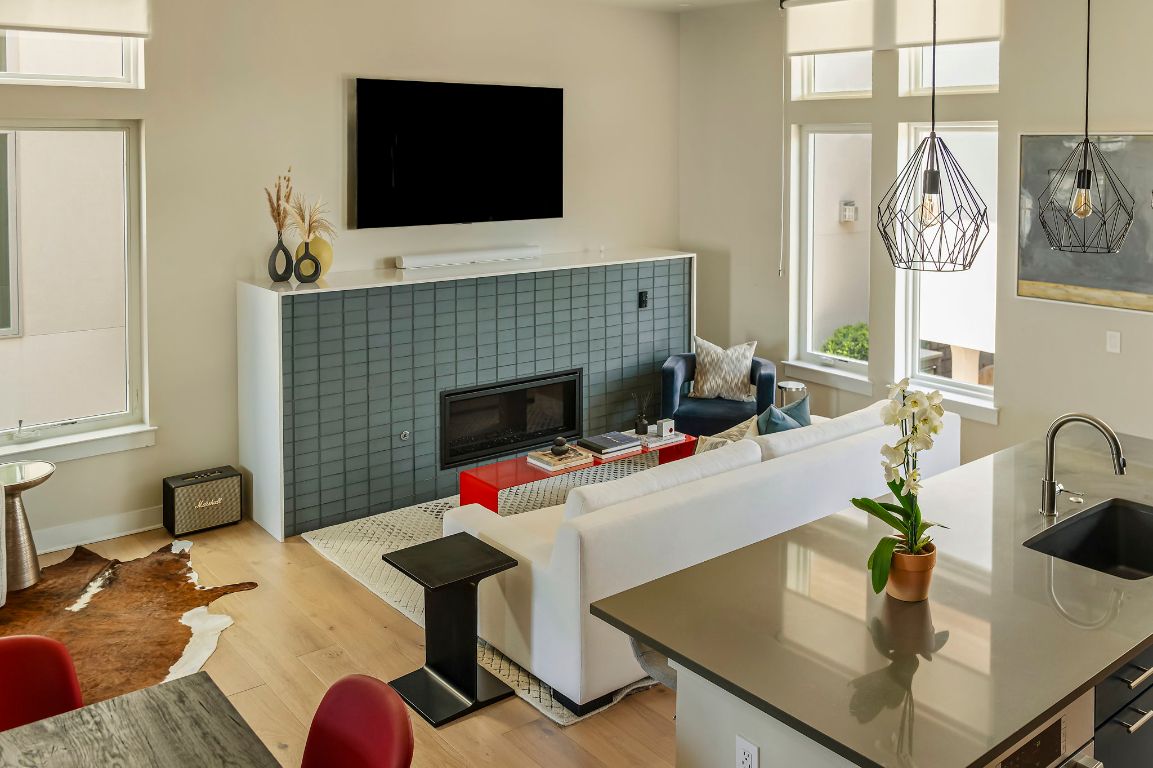 2300 Enfield Road, Unit 302 Austin, TX 78703 - Photo 4 of 26 a living room with furniture and a fireplace