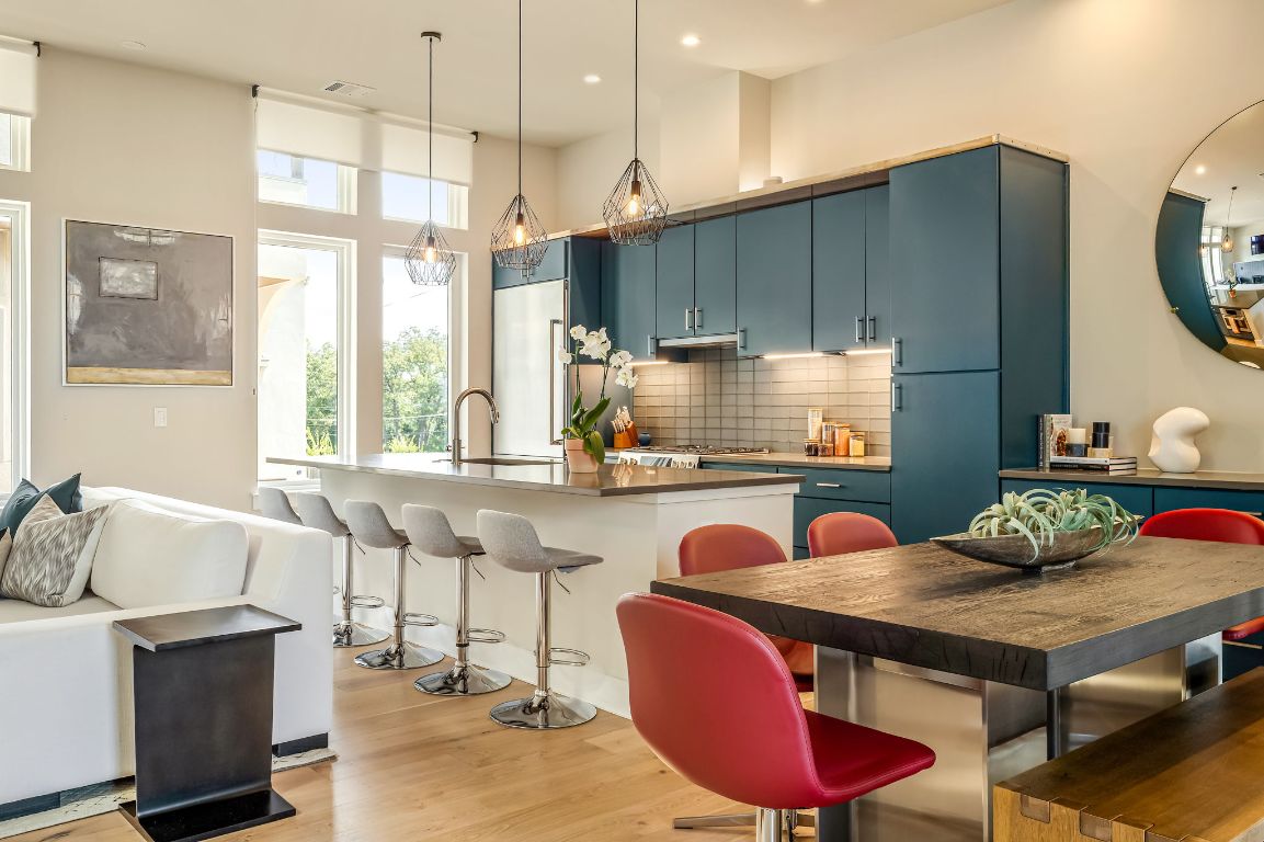 2300 Enfield Road, Unit 302 Austin, TX 78703 - Photo 5 of 26 a kitchen with a table chairs refrigerator and cabinets