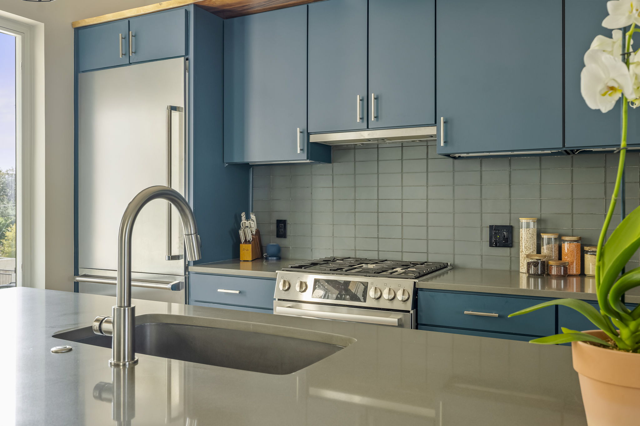 2300 Enfield Road, Unit 302 Austin, TX 78703 - Photo 7 of 26 a kitchen with a stove and a white wooden cabinets