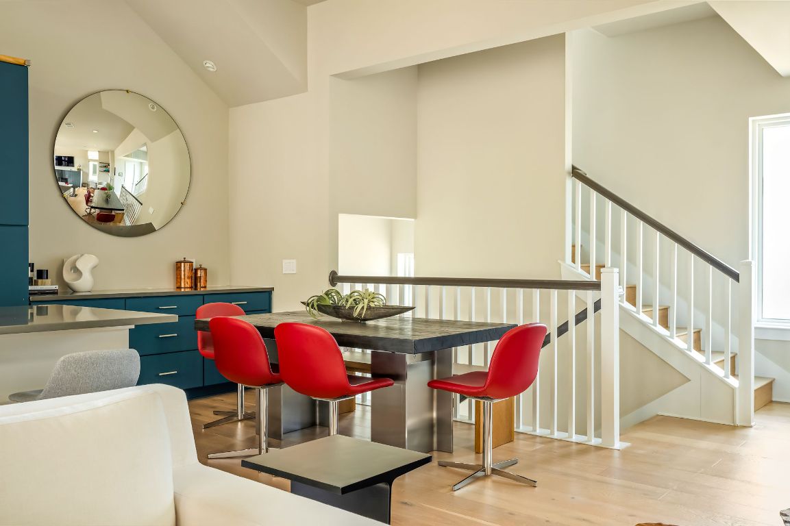 2300 Enfield Road, Unit 302 Austin, TX 78703 - Photo 9 of 26 a view of a dining room with furniture and a chandelier