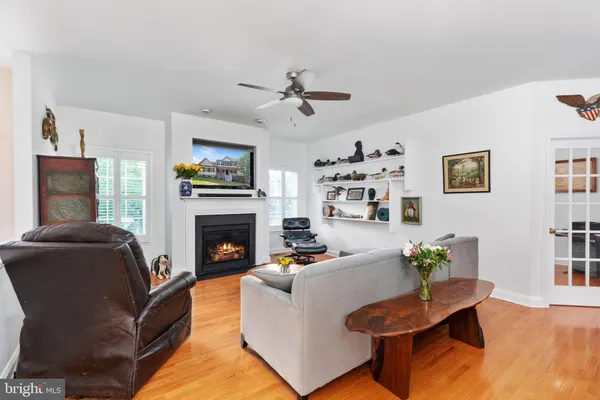 a kitchen with a stove a refrigerator a sink dishwasher with a dining table and chairs