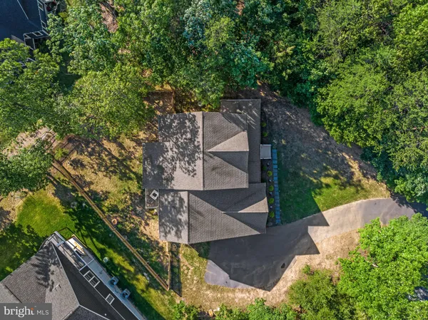 a view of a house with a wooden deck