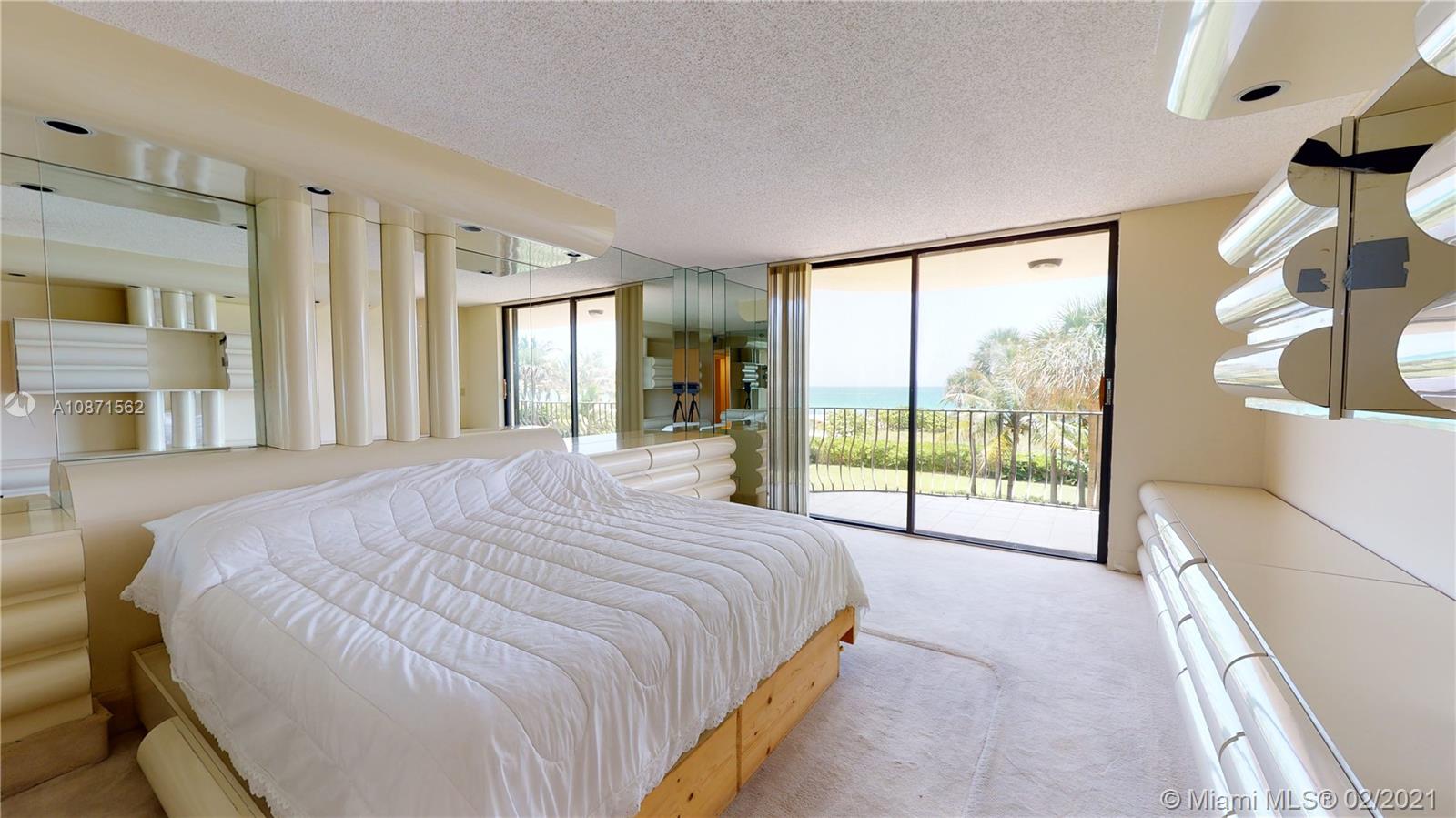 Normandy Beach Surfside, FL 33154 - Photo 5 of 18 a bed sitting in a spacious bedroom next to a large window