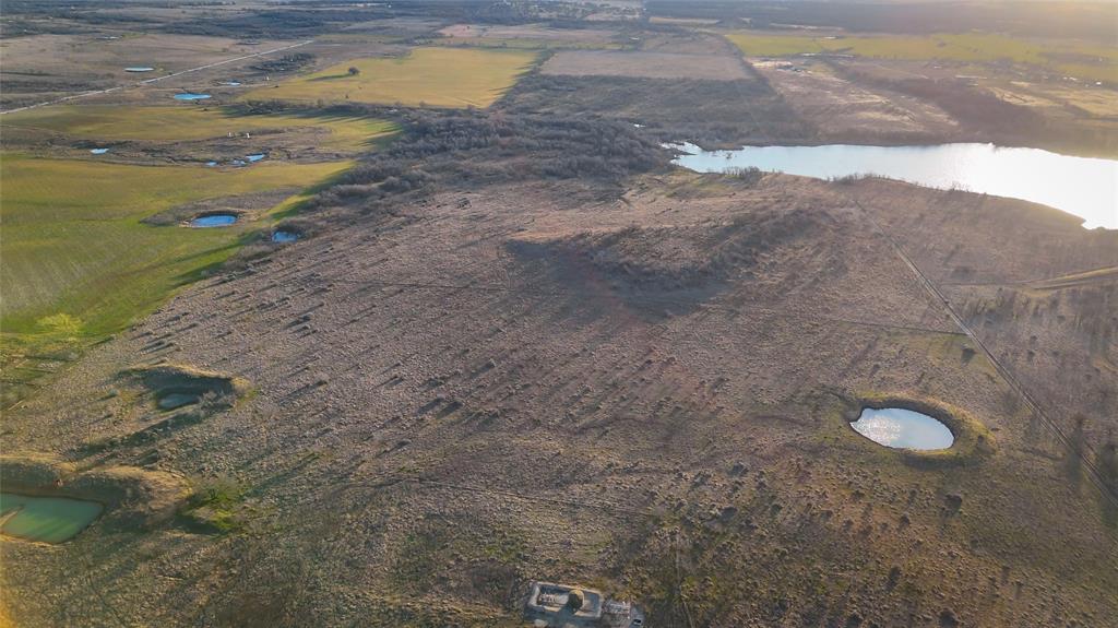 281 St Perrin Tx 76486 Perrin, TX 76486 - Photo 12 of 31 a view of a dry yard with wooden floor