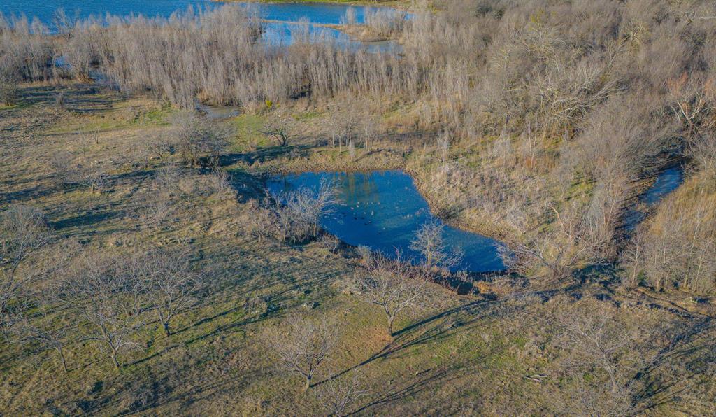 281 St Perrin Tx 76486 Perrin, TX 76486 - Photo 17 of 31 a view of a dry yard with wooden fence