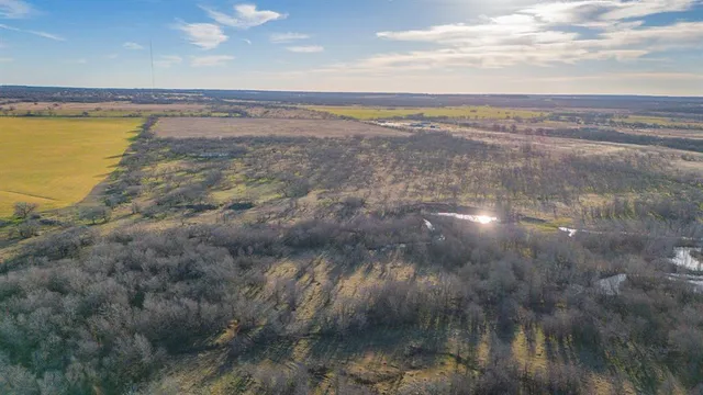 a view of a lake and a yard