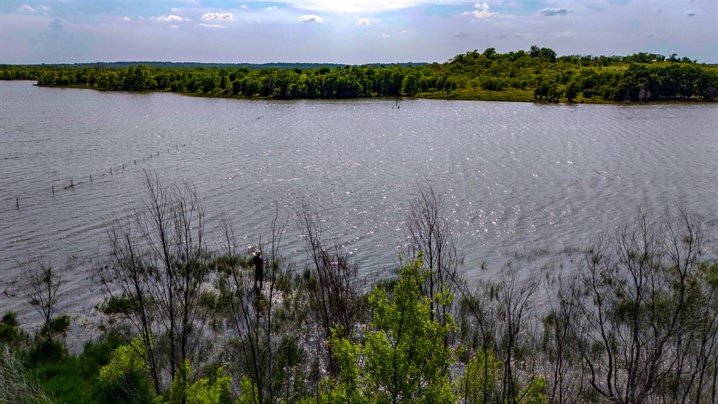 281 St Perrin Tx 76486 Perrin, TX 76486 - Photo 19 of 31 a view of a lake and a yard