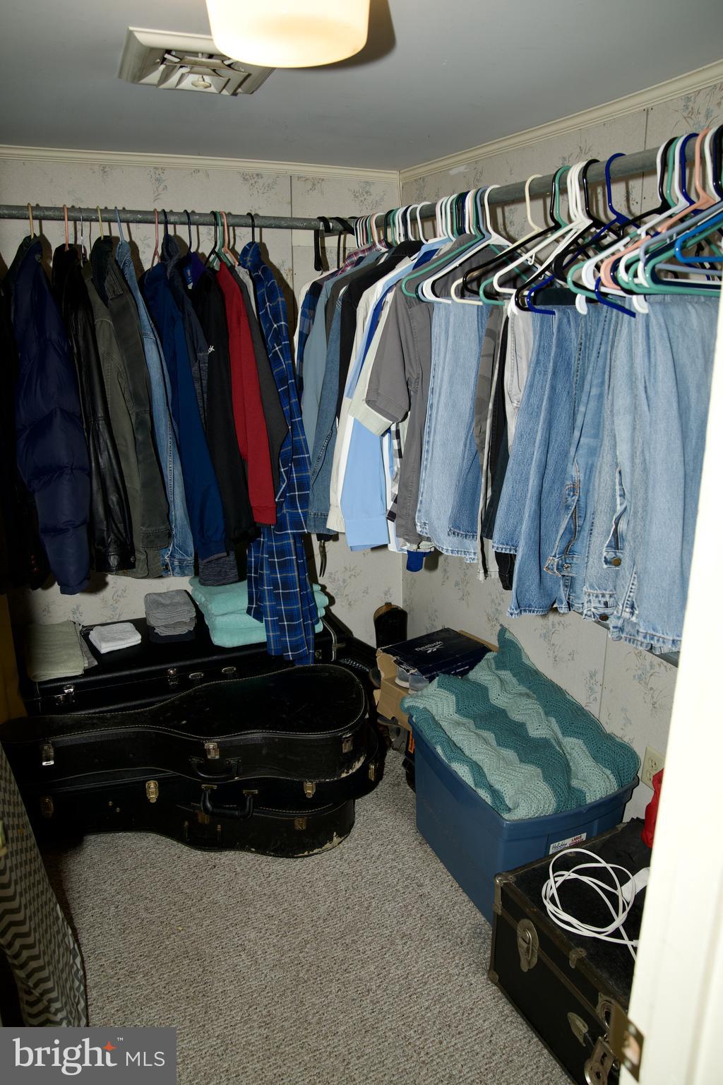31867 Shavox Road Salisbury, MD 21804 - Photo 24 of 64 a view of walk in closet with clothes and shoes