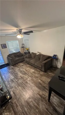 a living room with furniture and a lamp