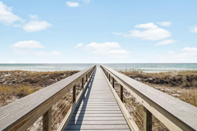 a front view of a residential apartment building with a yard