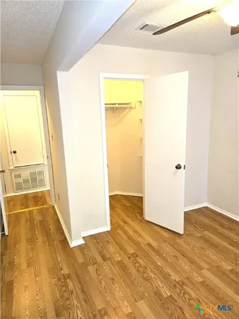 a view of a big room with wooden floor