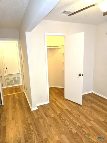 a view of a big room with wooden floor