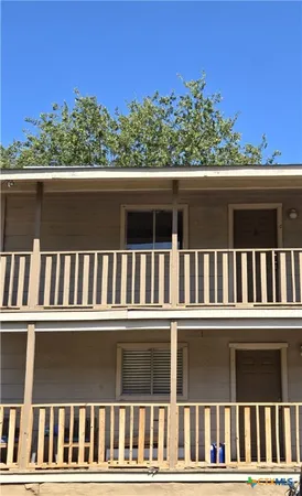 front view of a house with a fence