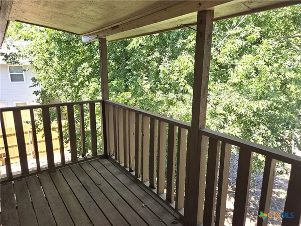 a view of wooden balcony with outdoor space