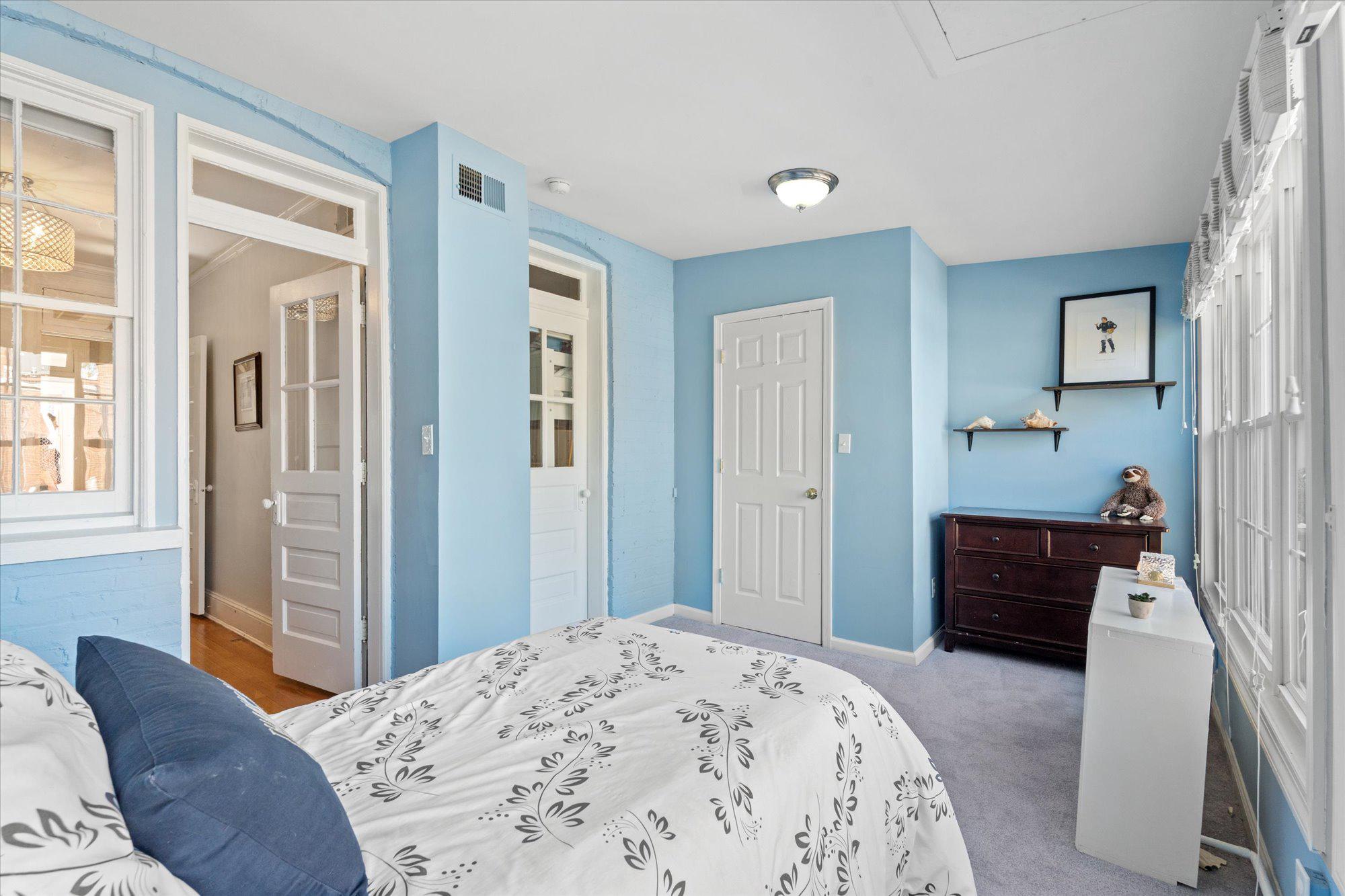 2305 38th Street Northwest Washington, DC 20007 - Photo 23 of 38 a bedroom with a bed and wooden floor