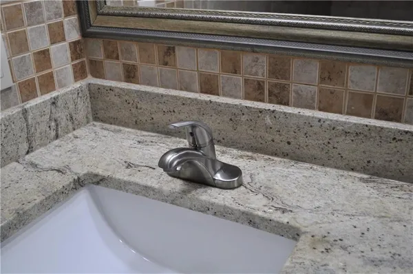 a close view of sink and mirror