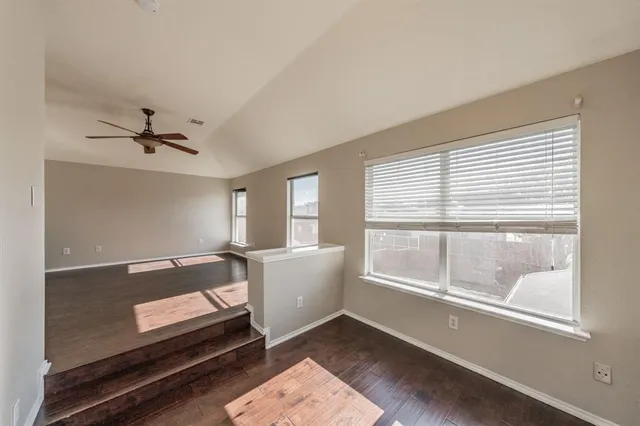 a view of an empty room with a window