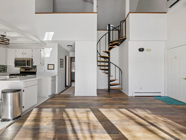 a view of a kitchen with a sink and dishwasher