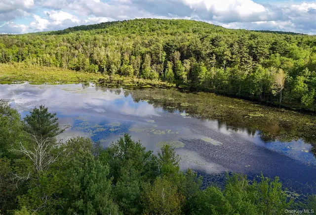 a picture of a bench in front of a wall