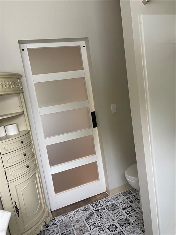 133 Weston Road Grove City, PA 16127 - Photo 16 of 44 Sliding barn door on the main floor full bathroom.