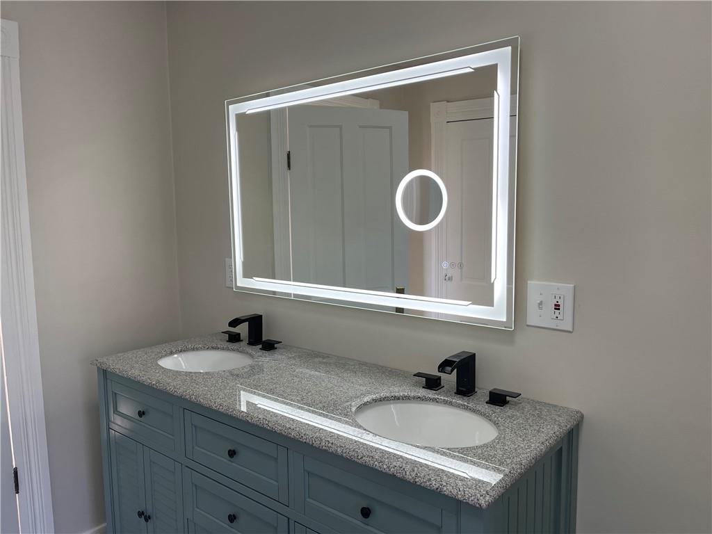 133 Weston Road Grove City, PA 16127 - Photo 32 of 44 Mirror has lots of features over the double sink vanity.