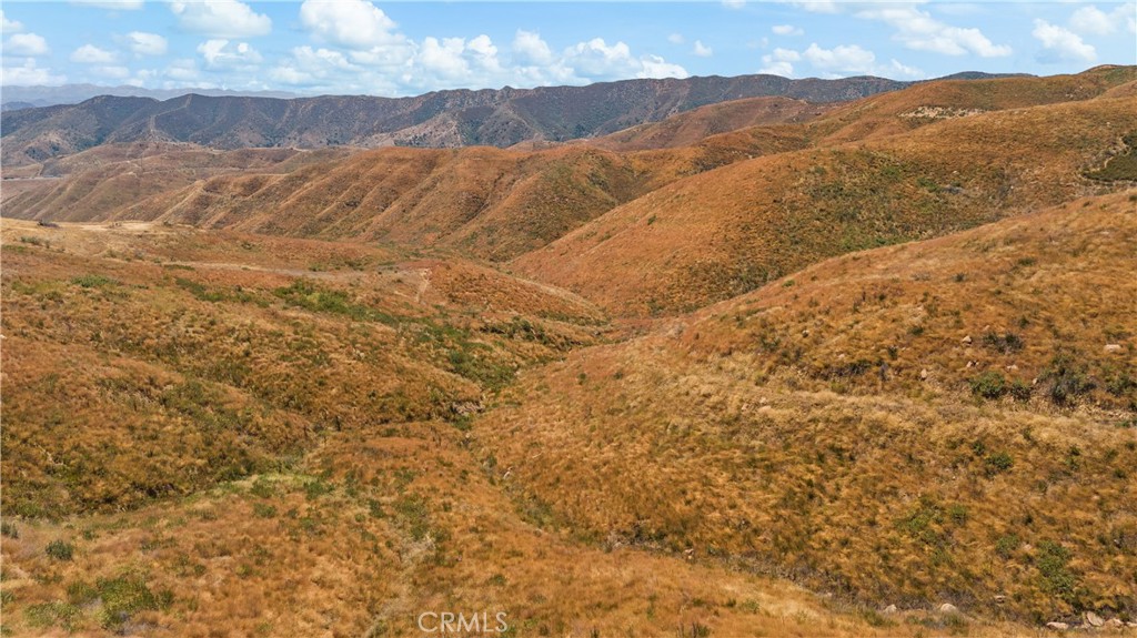 0 Ridge Rte Road Castaic, CA 91384 - Photo 5 of 9 a view of a mountain range in a cloudy sky
