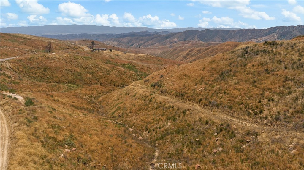 0 Ridge Rte Road Castaic, CA 91384 - Photo 6 of 9 a view of a mountain range in a cloudy sky