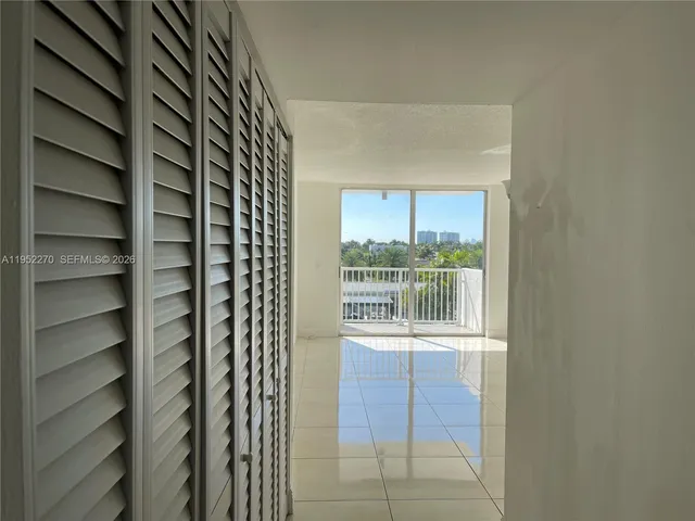 a view of a room that has a window in it