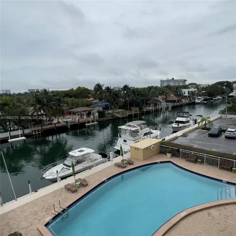 an aerial view of a house with a lake view