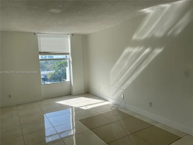 a view of an empty room and window
